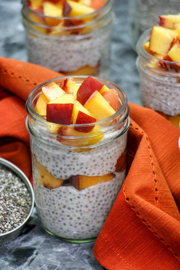 chia pudding mason jar with peaches on top