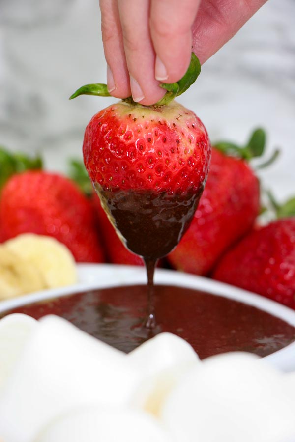 strawberry dipped in vegan chocolate sauce
