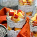 up close breakfast parfait peaches and cream chia pudding in glass jar