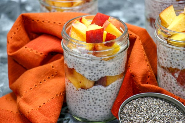 peaches and cream chia pudding with chia seeds and orange towel